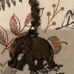 Bronze elephant with decorative chain. 3 1/2”L 2” W. Nice solid weight.